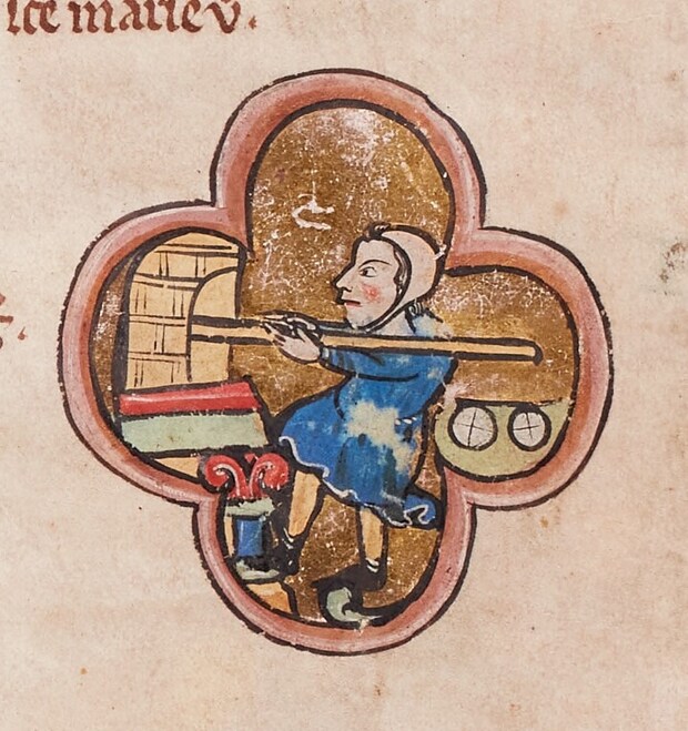 Baker_baking_bread_in_an_oven_-_miniature_in_a_13th_century_psalter