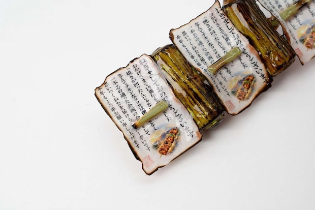 反対側にはメッセージも......って、「ねぎましておめでとうございます」！？（人間公式Xアカウント（@ningen_inc）の投稿より）