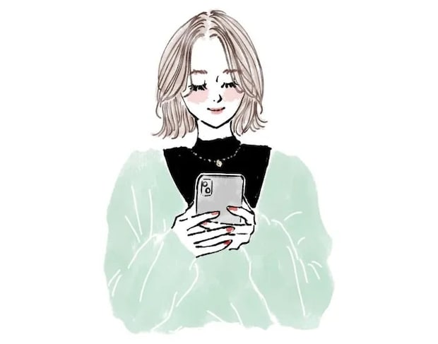 スマートフォンを操作する女性
