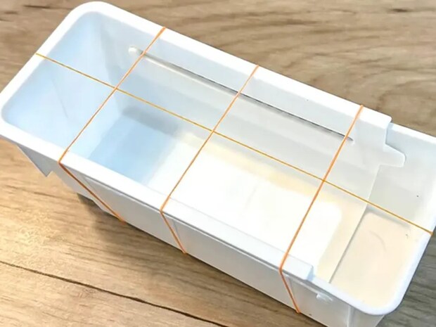 ただの空きケースがここまで使えるとは…　輪ゴムを『十字』にかけるだけで？