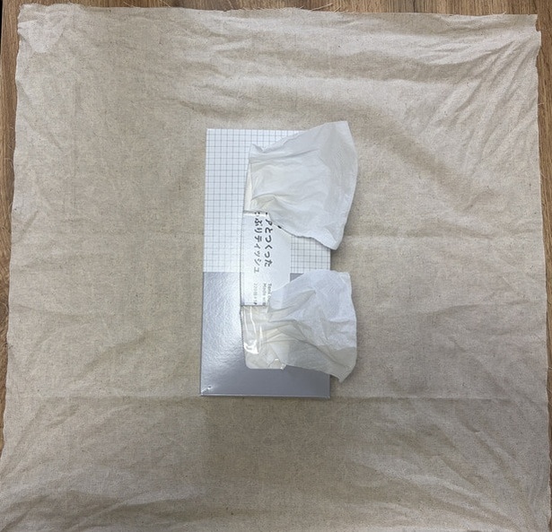 布の両サイドを結んで布で包む方法も（▶次へ）