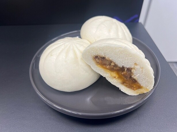 「背脂ニンニク月見まん」