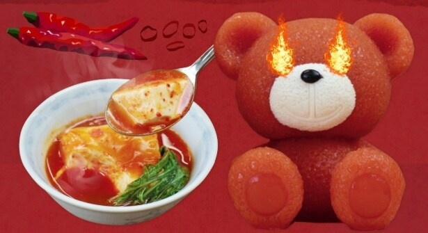 唐辛子の辛みが効いたチゲ鍋に真っ赤なくまちゃんが登場。見た目のインパクトとスパイシーな香りで食欲を刺激する
