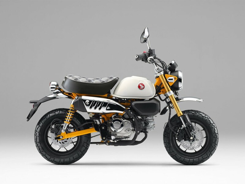 レトロなミニバイクとオレンジ仕上げのフレーム.