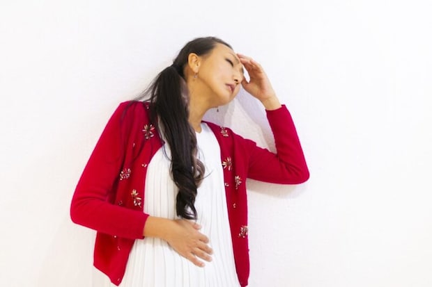 体調不良の女性